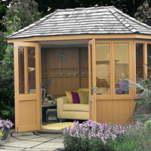 a wooden summerhouse with black slate roof